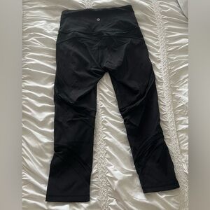 Black lululemon leggings with mesh stripes size 4